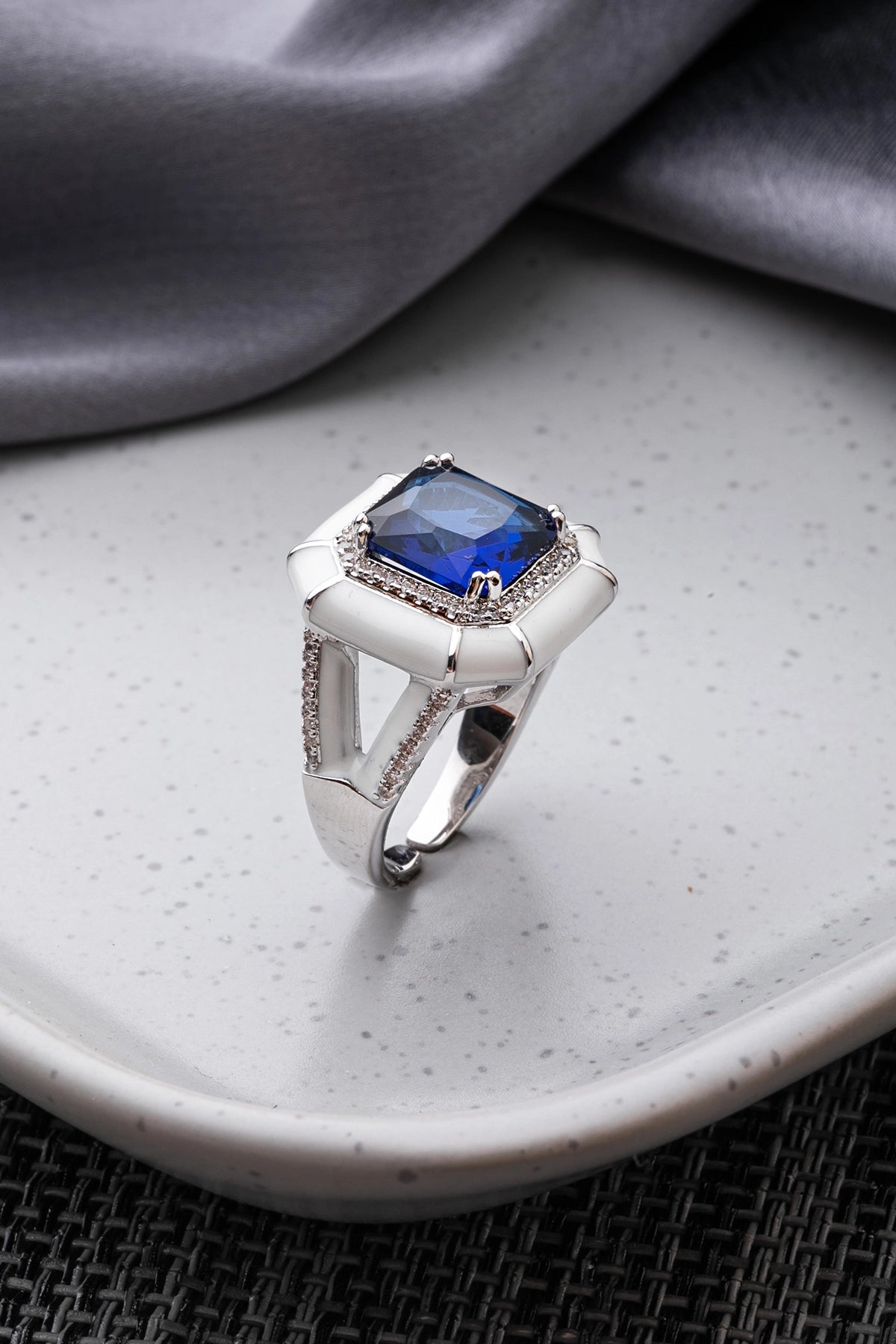 White Enameled Ring with Blue Stone  White Rhodium Finish  Adjustable Size