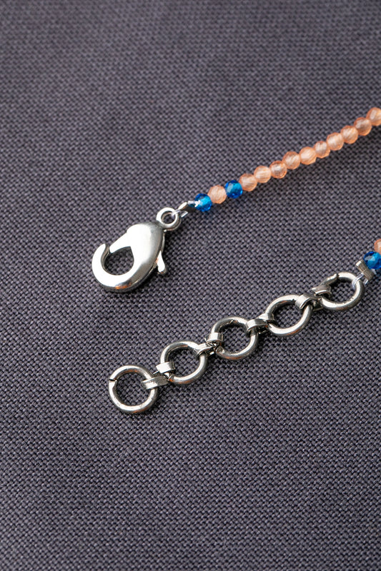 Evil Eye Pendant in Peach Crystal Beads with Blue Accents  White Rhodium Finish  Adjustable  18 Inches