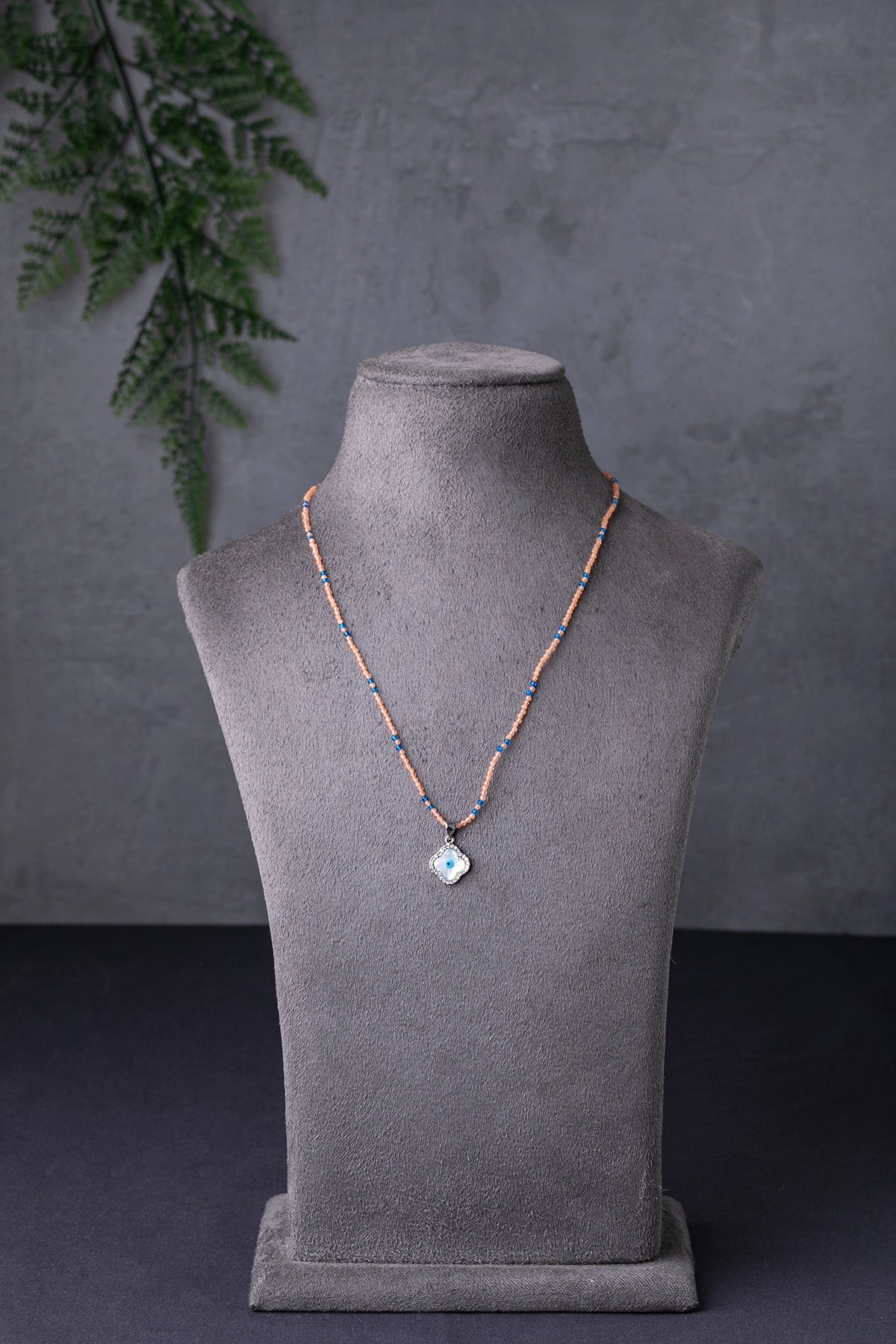 Evil Eye Pendant in Peach Crystal Beads with Blue Accents White Rhodium Finish Adjustable 18 Inches